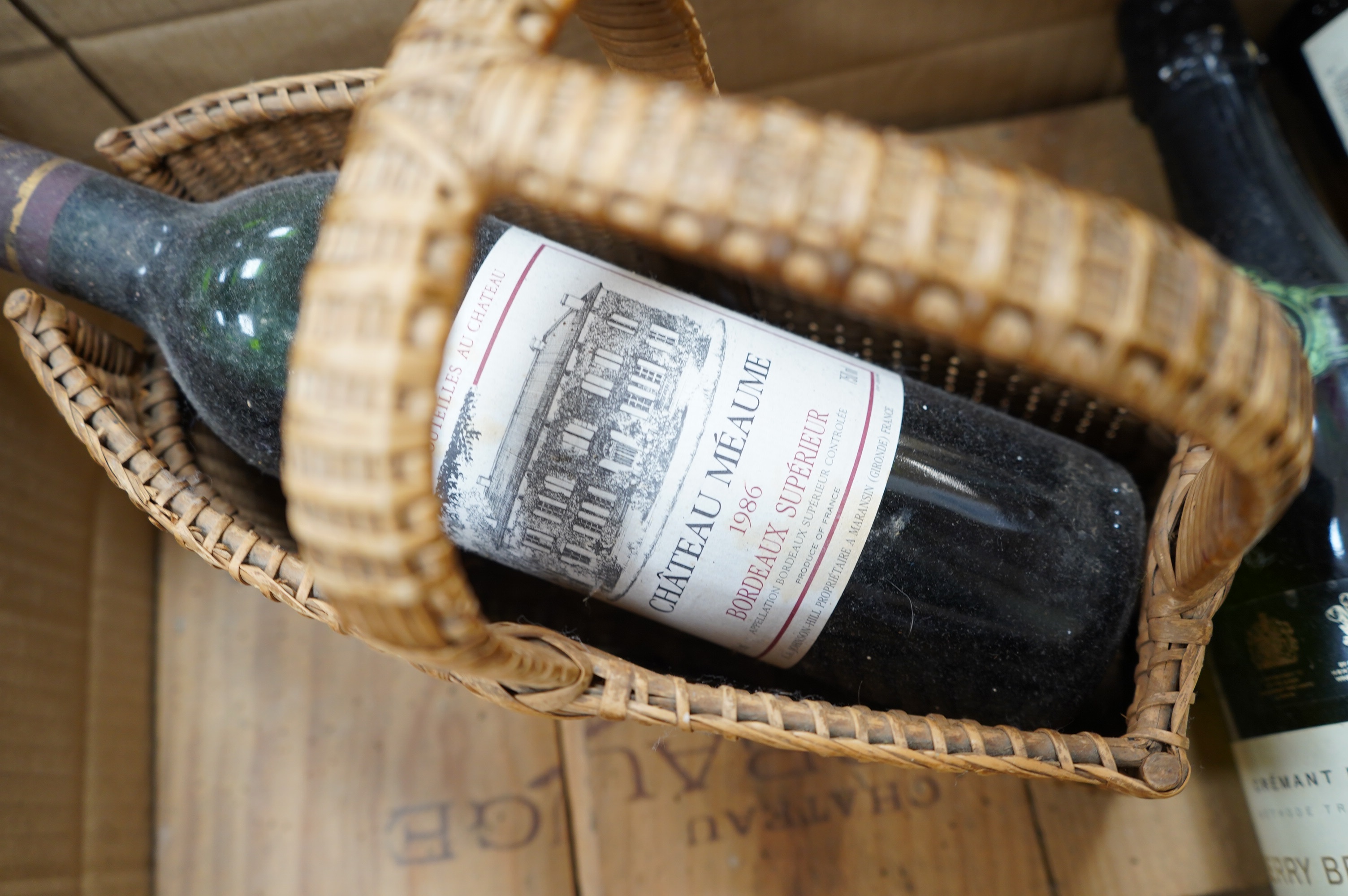 Two large bottles of Chateau Fombrange in wooden crate and three other bottles. Condition - fair, storage unknown